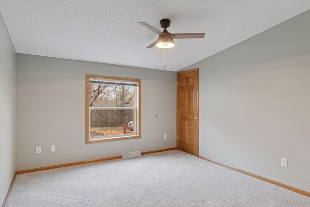 34115 Malmberg Ave, Chisago Lake Twp, MN 55045 - spare room featuring carpet, ceiling fan, a textured ceiling, and vaulted ceiling