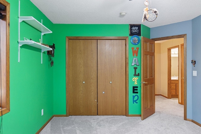 34115 Malmberg Ave, Chisago Lake Twp, MN 55045 - carpeted bedroom featuring a closet and a textured ceiling