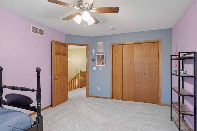34115 Malmberg Ave, Chisago Lake Twp, MN 55045 - bedroom featuring light carpet, a closet, a ceiling fan, and a textured ceiling