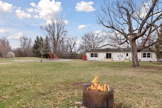 34115 Malmberg Ave, Chisago Lake Twp, MN 55045 - view of grassy yard with an outdoor fire pit