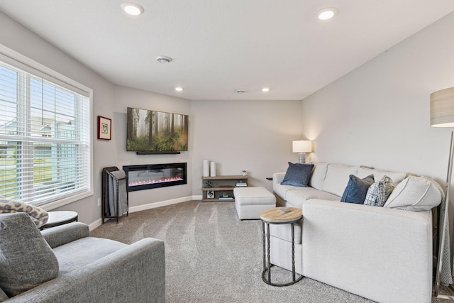 9444 Bridle Way, Victoria, MN 55386 - living area with carpet flooring, baseboards, recessed lighting, and a glass covered fireplace