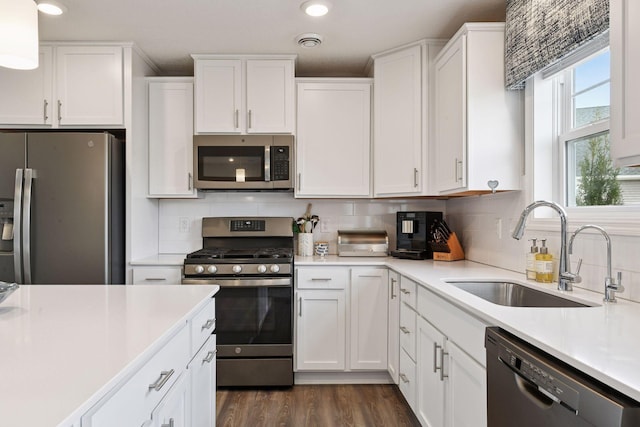 9444 Bridle Way, Victoria, MN 55386 - kitchen with appliances with stainless steel finishes, a sink, white cabinetry, light countertops, and recessed lighting