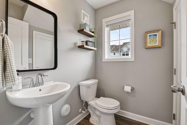 9444 Bridle Way, Victoria, MN 55386 - bathroom featuring baseboards, wood finished floors, and toilet