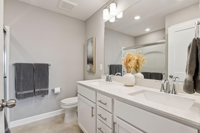 9444 Bridle Way, Victoria, MN 55386 - bathroom featuring double vanity, toilet, a stall shower, recessed lighting, and baseboards