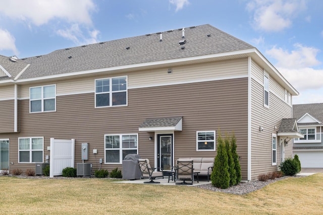 9444 Bridle Way, Victoria, MN 55386 - rear view of property featuring a yard, a patio, and a shingled roof