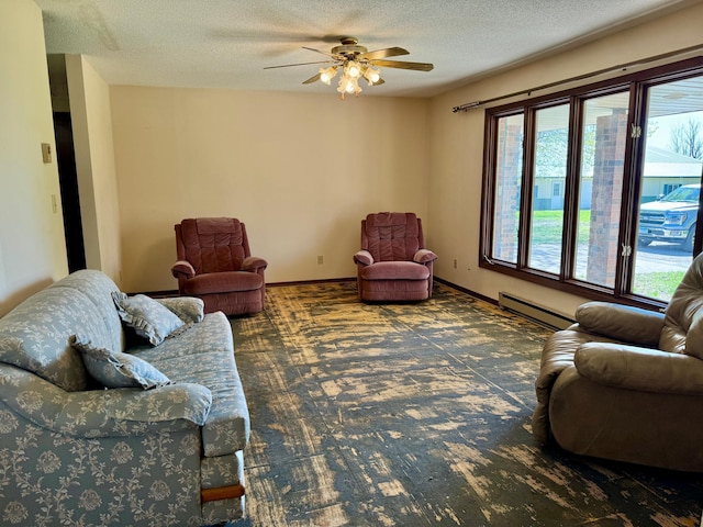 living room with a baseboard radiator, a ceiling fan, a textured ceiling, carpet, and baseboards