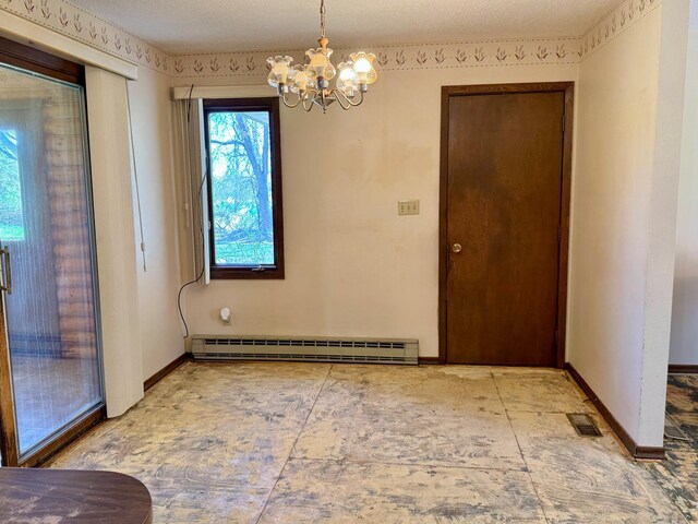 unfurnished dining area with a baseboard heating unit, a chandelier, and baseboards