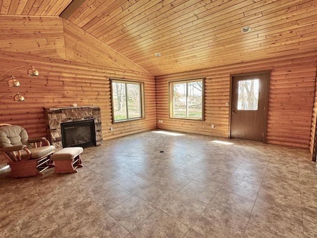 unfurnished living room with wooden ceiling, high vaulted ceiling, a fireplace, and rustic walls