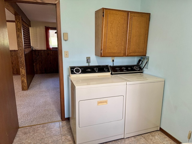 laundry area featuring cabinet space and washing machine and clothes dryer