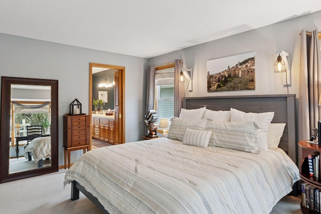 carpeted bedroom with ensuite bathroom