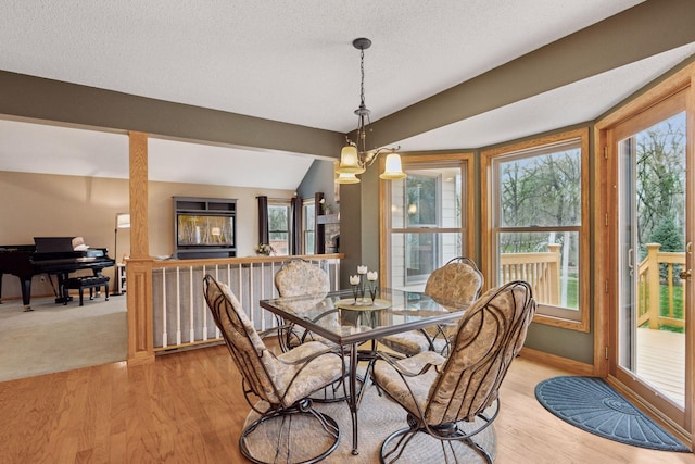 dining room with baseboards and light wood-style floors