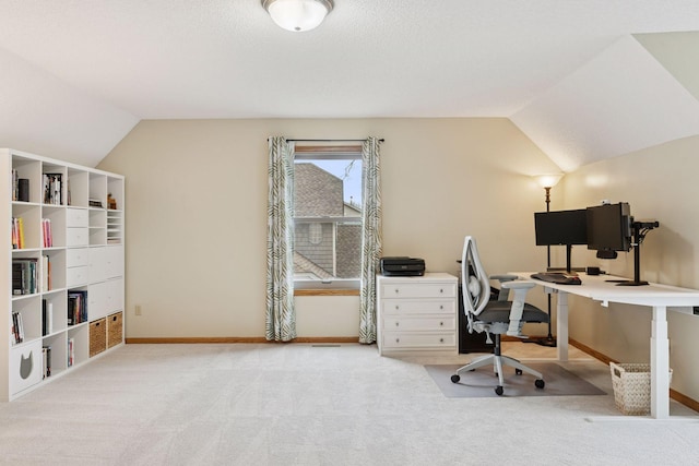 home office with baseboards, carpet flooring, and lofted ceiling