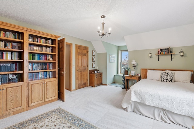 bedroom with an inviting chandelier and light carpet