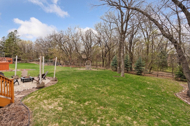 view of yard with a fire pit