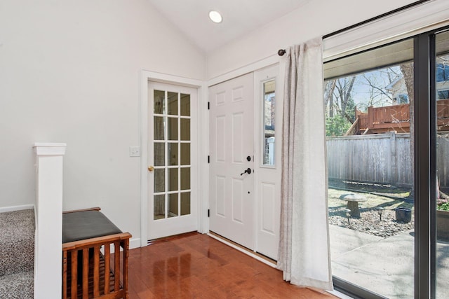 entrance foyer featuring lofted ceiling, wood finished floors, and recessed lighting