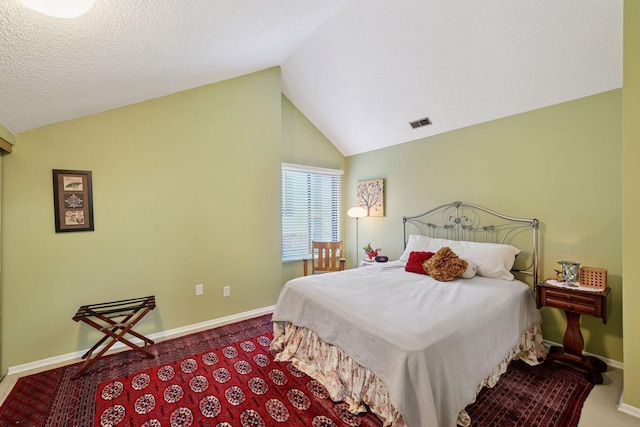 carpeted bedroom with lofted ceiling and baseboards