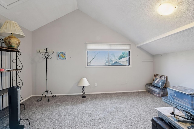 living area with carpet, lofted ceiling, a textured ceiling, and baseboards