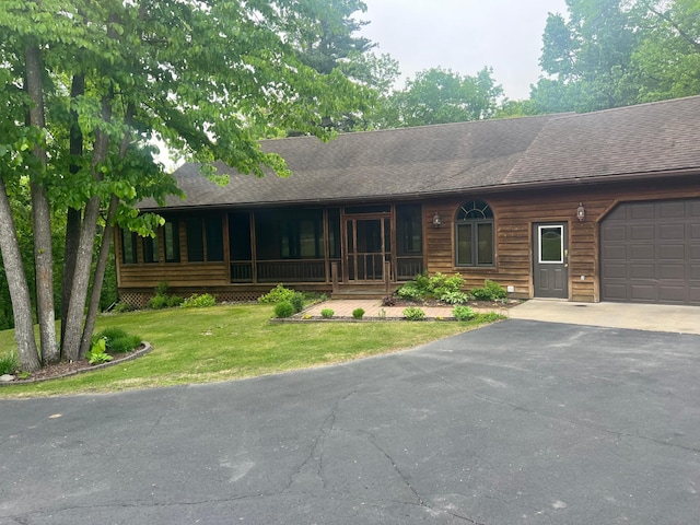 10822 Steamboat Loop NW, Walker, MN 56484 - view of front of house featuring driveway, an attached garage, a front yard, and roof with shingles
