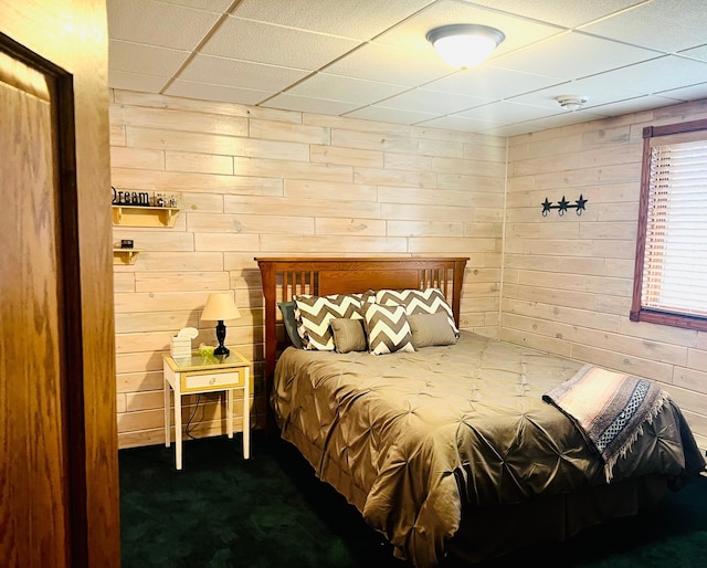 10822 Steamboat Loop NW, Walker, MN 56484 - bedroom with wood walls, a paneled ceiling, and dark colored carpet