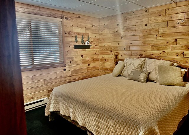 10822 Steamboat Loop NW, Walker, MN 56484 - bedroom featuring baseboard heating and wood walls