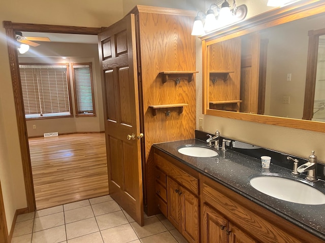 10822 Steamboat Loop NW, Walker, MN 56484 - full bath with tile patterned floors, double vanity, and ceiling fan