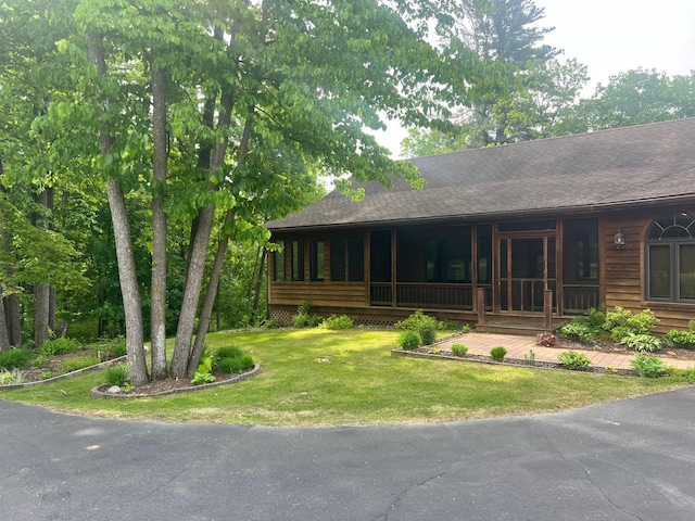 10822 Steamboat Loop NW, Walker, MN 56484 - view of front facade featuring a front yard, covered porch, and roof with shingles