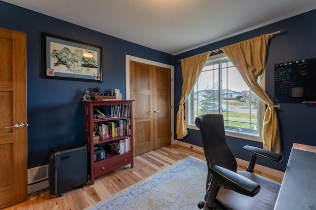 21107 Ghia St NE, East Bethel, MN 55011 - office area featuring wood finished floors, baseboards, and visible vents