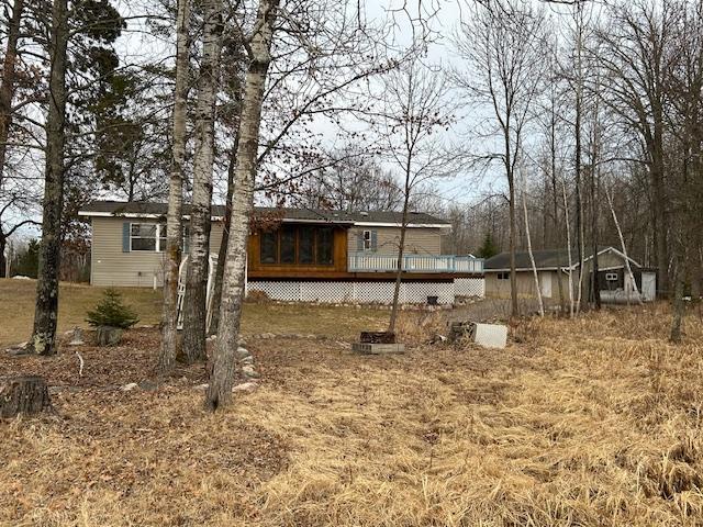 54966 Rainbow Rd, Sand Lake Twp, MN 56636 - back of property with a wooden deck