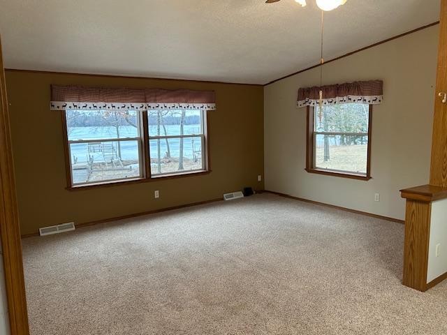 54966 Rainbow Rd, Sand Lake Twp, MN 56636 - empty room featuring carpet floors, lofted ceiling, and ceiling fan