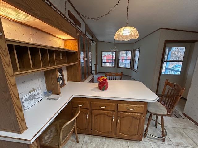 54966 Rainbow Rd, Sand Lake Twp, MN 56636 - kitchen with a peninsula, open shelves, light countertops, and a kitchen bar