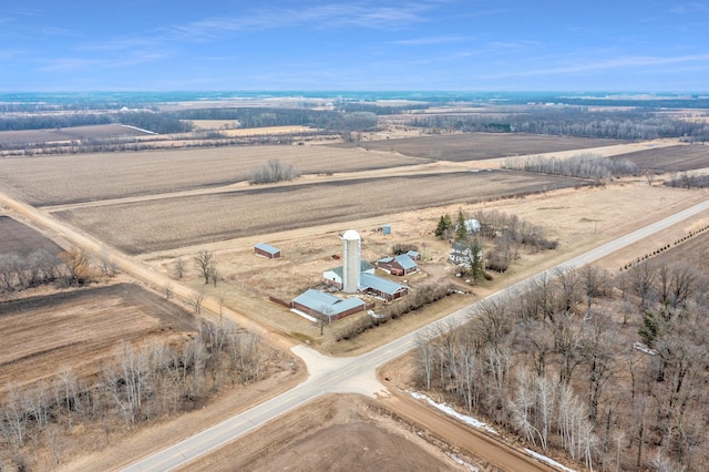 birds eye view of property with a rural view