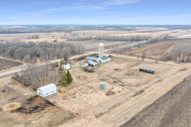 birds eye view of property featuring a rural view