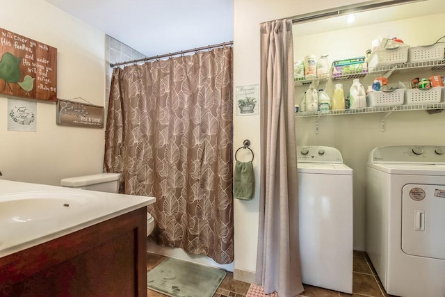 bathroom with a shower with shower curtain, toilet, vanity, and washing machine and dryer