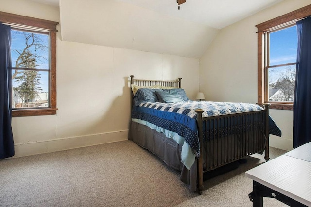 bedroom featuring vaulted ceiling and carpet floors