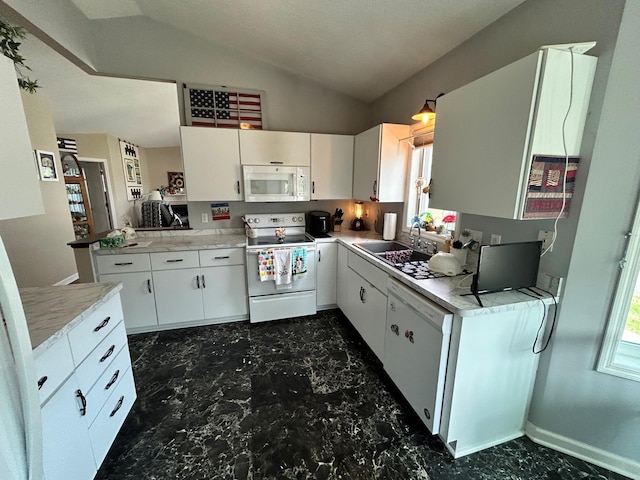 2548 Sumac Rdg, White Bear Lake, MN 55110 - kitchen with a sink, light countertops, lofted ceiling, white appliances, and white cabinetry