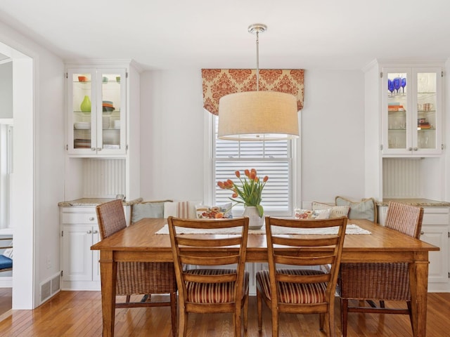 dining area with light wood-style floors