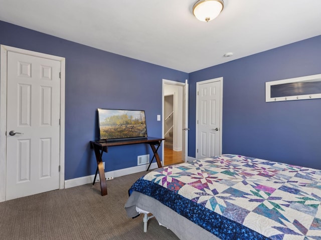 bedroom with carpet flooring and baseboards