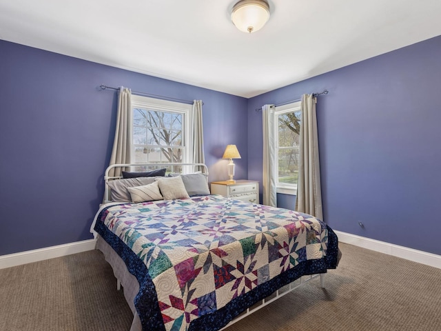 carpeted bedroom with baseboards