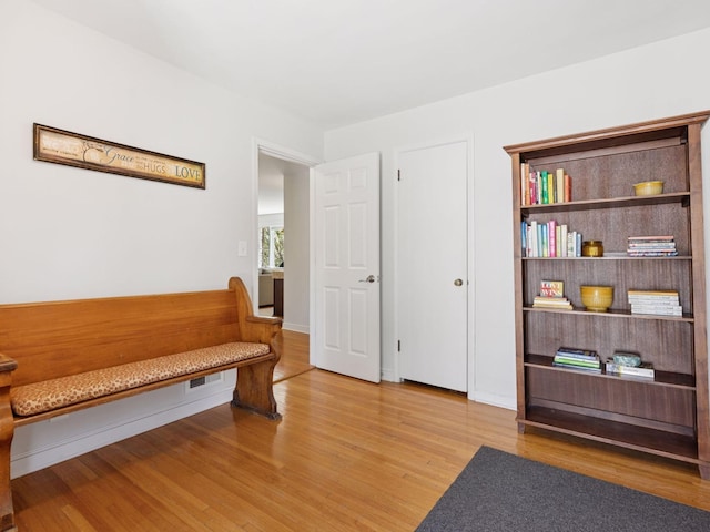sitting room featuring wood finished floors