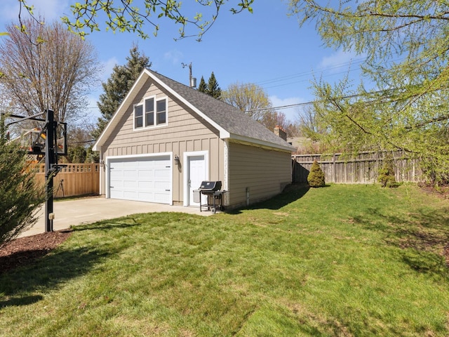 detached garage featuring driveway