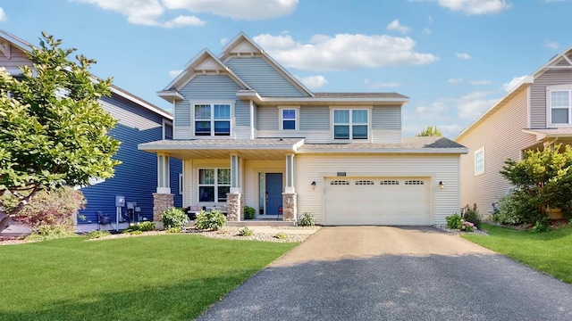 11373 Balsam Way, Woodbury, MN 55129 - craftsman-style home featuring a front yard, covered porch, a garage, and aphalt driveway