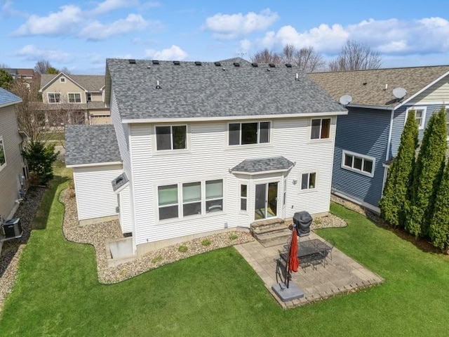 11373 Balsam Way, Woodbury, MN 55129 - rear view of house featuring a patio, entry steps, a yard, and a shingled roof