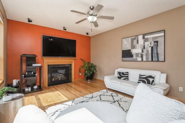 11373 Balsam Way, Woodbury, MN 55129 - living area with ceiling fan, wood finished floors, and a high end fireplace