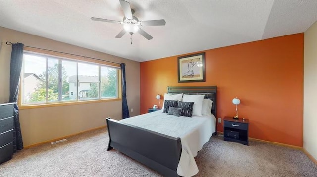 11373 Balsam Way, Woodbury, MN 55129 - carpeted bedroom with baseboards, a ceiling fan, and visible vents