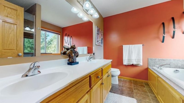 11373 Balsam Way, Woodbury, MN 55129 - bathroom featuring a bath, toilet, a sink, double vanity, and baseboards
