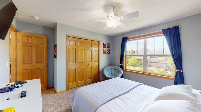 11373 Balsam Way, Woodbury, MN 55129 - carpeted bedroom featuring a textured ceiling, a closet, and a ceiling fan