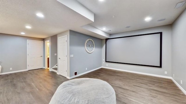 11373 Balsam Way, Woodbury, MN 55129 - home theater featuring baseboards, recessed lighting, and wood finished floors
