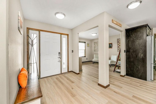1408 72nd Ave S, Fargo, ND 58104 - entryway with light wood finished floors and baseboards