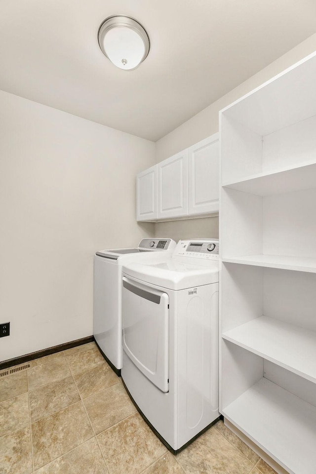 1408 72nd Ave S, Fargo, ND 58104 - laundry room with washer and dryer, cabinet space, and baseboards