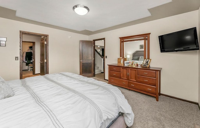 1408 72nd Ave S, Fargo, ND 58104 - bedroom with light colored carpet, baseboards, and a spacious closet